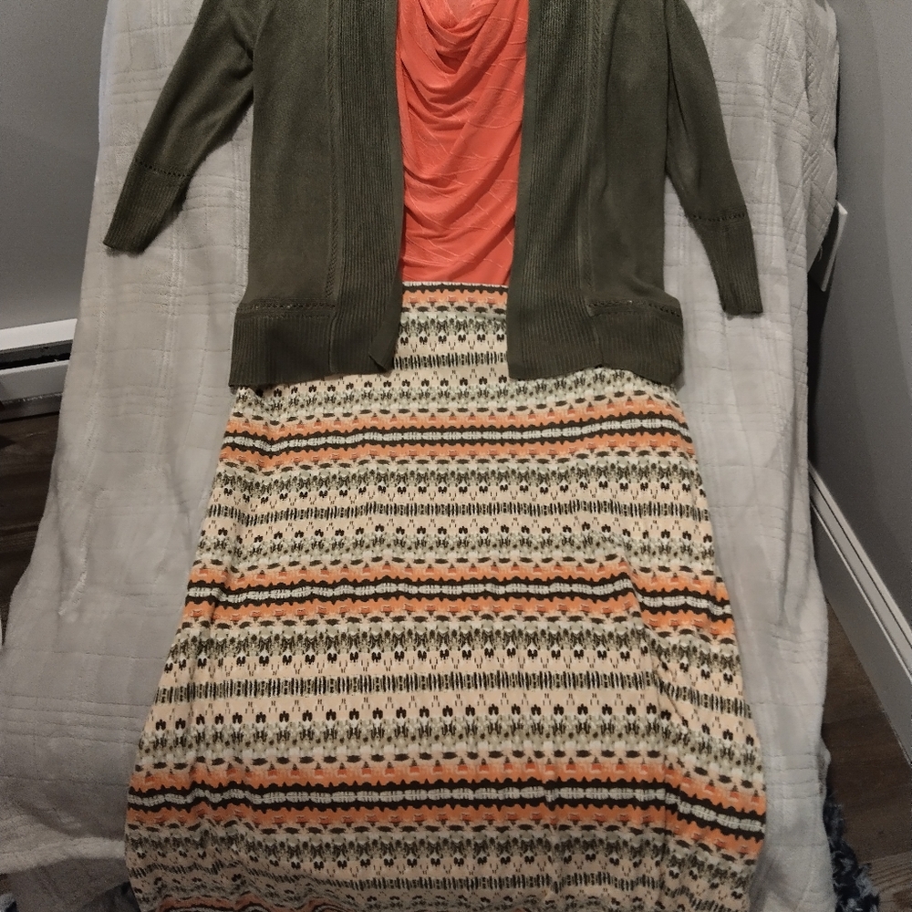 Olive Green Cardigan with Pink and Cream Patterned Skirt, Pink Sleeveless Shirt.